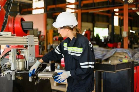 Mechanical engineers repairing engine machine at factory 写真素材