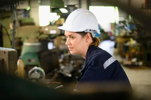 Mechanical engineers repairing engine machine at factory 写真素材