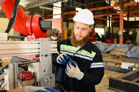 Mechanical engineers repairing engine machine at factory 写真素材