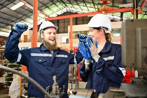 Mechanical engineers repairing engine machine at factory 写真素材