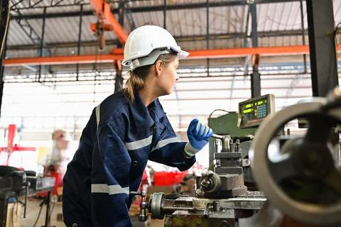 Mechanical engineers repairing engine machine at factory 스톡 사진