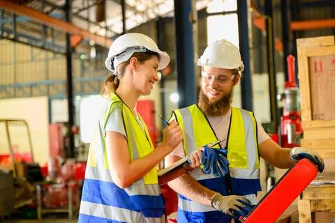 Mechanical engineers repairing engine machine at factory 写真素材