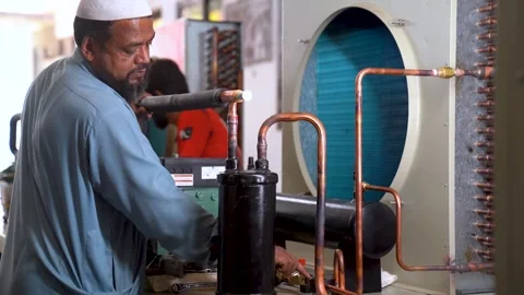 Mechanical Engineers Working On Machine Equipment In A Metalworking Facility In Stock Footage 333615273