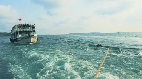 Mechanical Failure at Sea, Close Up of a Power Boat Being Towed by Rope Stock Footage 319346239