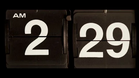 Mechanical flip clock changes from two twenty nine am Stock Footage 329673944