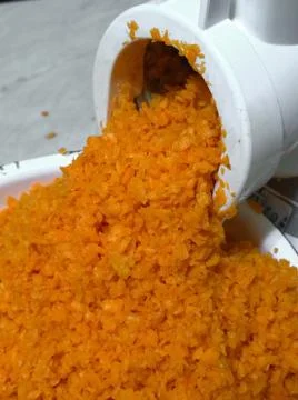 Mechanical grinding of carrots Stock Photos