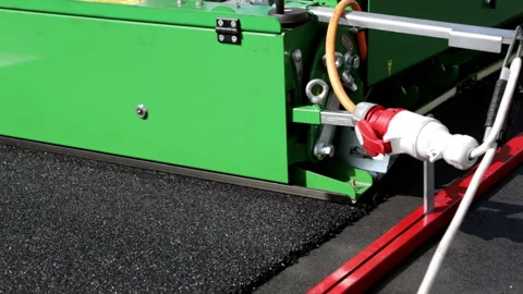 Mechanical laying of roads, bicycle paths, treadmills. A special machine makes Stock Footage 180054780