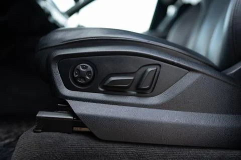 Mechanical levers at side of driver's seat for adjusting position, height and Stock Photos