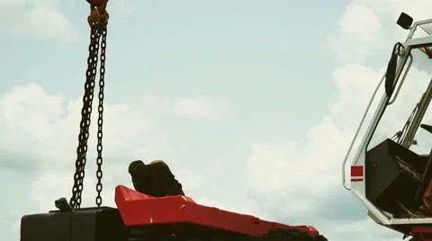 Mechanical lift, mobile crane, hook. Silhouette of a man working. Stock Footage 65792671