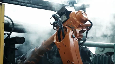 Mechanical Limb with Hydraulic Hoses Operating in Assembly Line - 4K Stock Footage 151937144