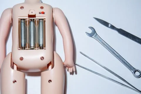 Mechanical live talking battery powered singing doll and scalpel, tweezers an Stock Photos