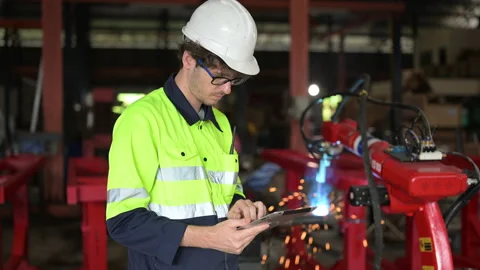 Mechanical maintenance engineer using tablet working at factory Stock Footage 237624329