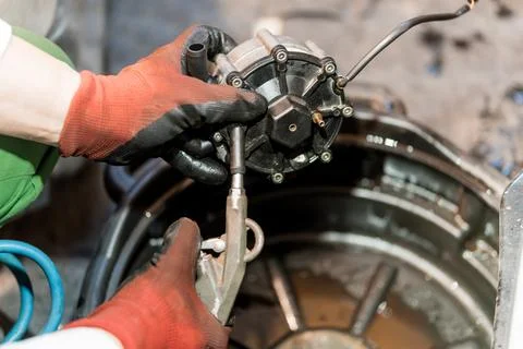 Mechanical Maintenance: A Technician Repairs an Engine Component with Precisi 写真素材