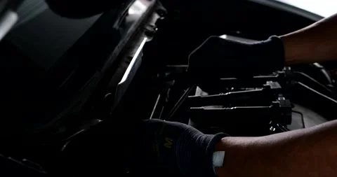 Mechanical man hand checking and change ignition coil with spark plug Stock Footage 219727611