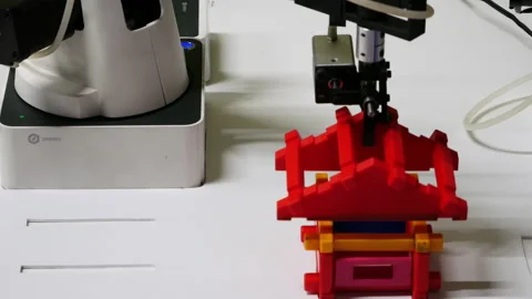 Mechanical manipulator. A school project demonstrates a robotic arm that assembl Stock Footage 151496198