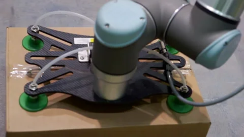 Mechanical manipulator stacks cardboard boxes. Stock Footage 142831826