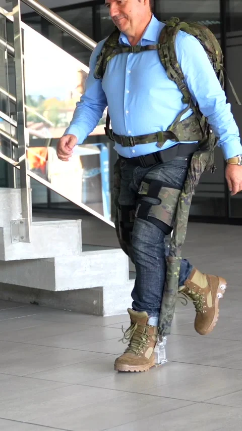 Mechanical military exoskeleton to help unrecognizable soldiers and military Stock Footage 258659293