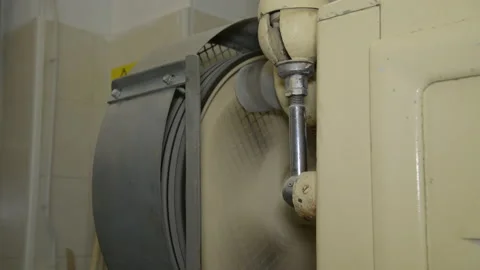 A mechanical mill that grinds whole grain wheat at a small mill in Puglia, Italy Stock Footage 173473928