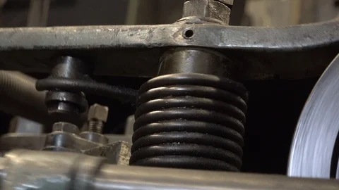 Mechanical movement with spring return on a chain production machine Stock Footage 101820600