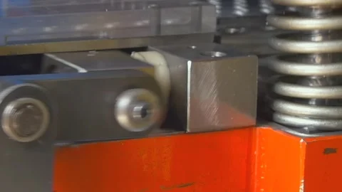 Mechanical Piston Rhythmic Motion Within a Modern Industrial Factory Setting Stock Footage 340486477