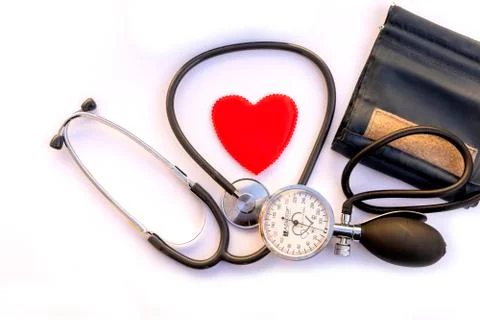 Mechanical pressure measuring device, red heart on white background . Concept Stock Photos