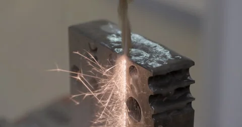 Mechanical processing of a metal part, coolant flow, bright sparks flying Stock Footage 278421160