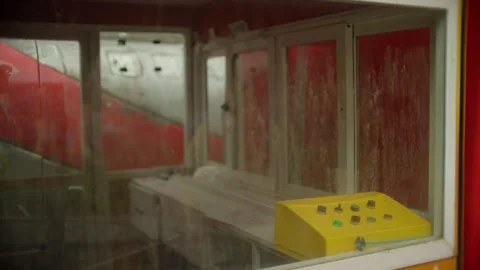 Mechanical push buttons on yellow control console in Borjomi Georgia ride booth Stock Footage 346926026