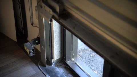 Mechanical sheet doors close in warehouse Stock Footage 140213116