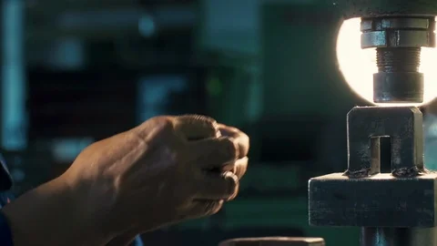 Mechanical Stamping Machine. Factory Worker Stamps the Small Metal Details Stock Footage 127169689
