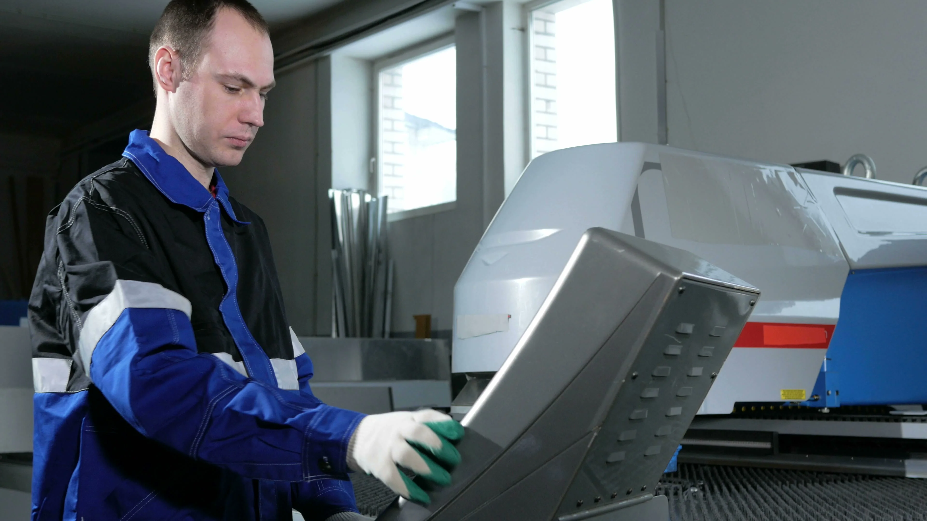 mechanical technician programming punching the machine cnc a man mechanical technician