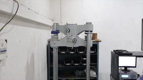 Mechanical testing machine in a laboratory environment within an industrial Stock Footage 320998729
