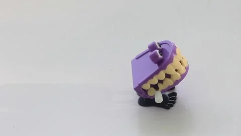 Mechanical toy with big teeth clockwork Stock Footage 249537979