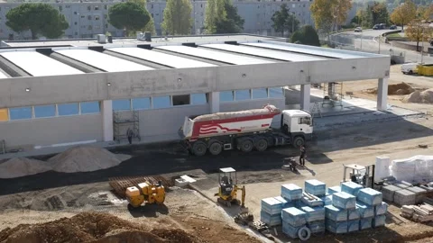 Mechanical vehicles and workers are at work on a construction site 库存影片 244007301