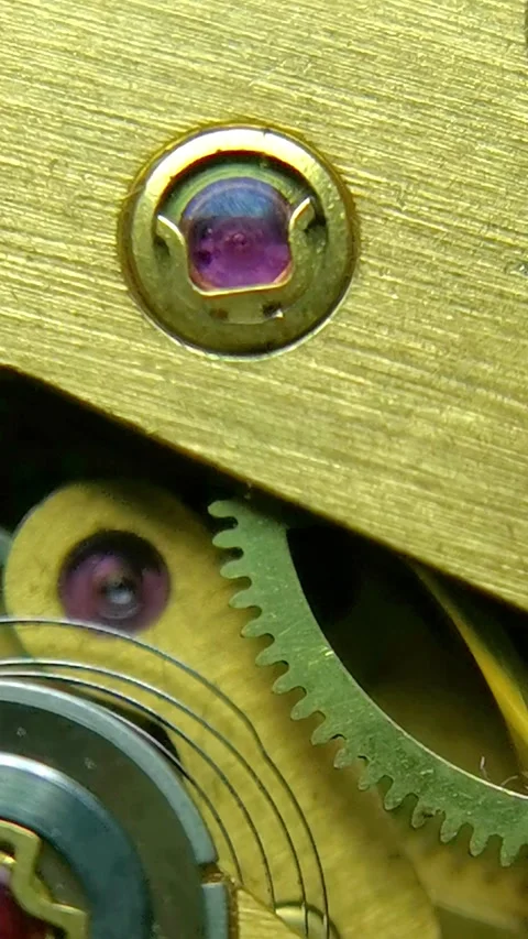 Mechanical Watch Movement - Vertical Macro of Gears and Ruby Jewel Stock Footage 339521862