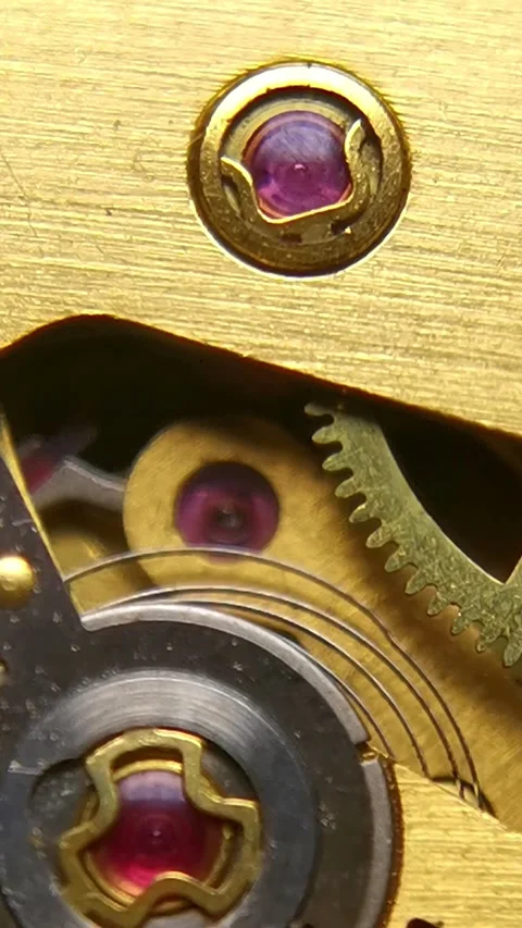 Mechanical Watch Movement - Vertical Macro of Ruby Jewels and Shock Protection 스톡 동영상 339529480
