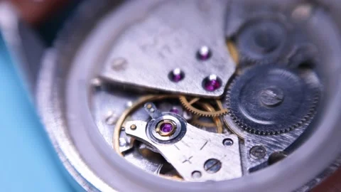 Mechanical wind watch center wheel in action, closeup 4k shallow DOF Stock Footage 165844843