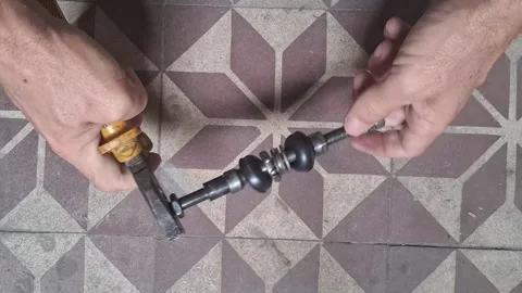 Mechanical worker assembling metal bolt components in motion video footage Stock Footage 339249010
