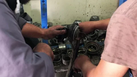 Mechanics assembling car suspension control arm Stock-Footage 346411000