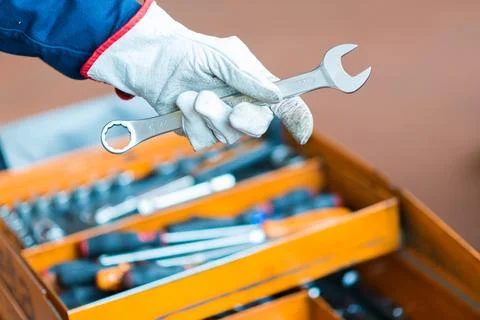Mechanic's hand holding a wrench Stockfoto's