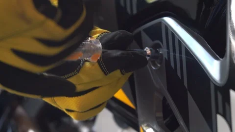Mechanic's hands tightening a bolt head ... | Stock Video | Pond5
