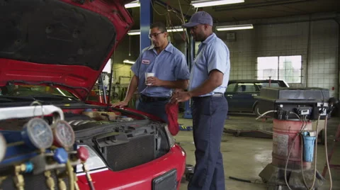 Mechanics talking about car Stock-Footage 61676517