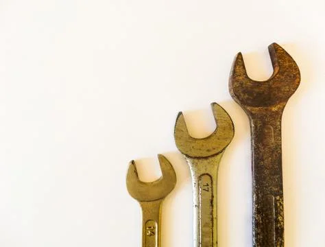 Mechanic's tool: three old rusty wrenches, arranged vertically to the right,  Stock Photos