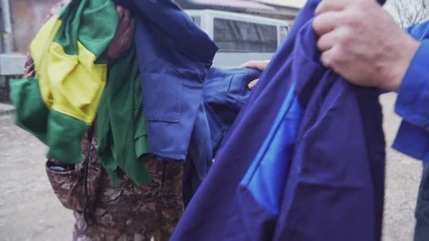 Mechanics try on new work clothes Stock Footage 102236613