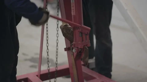 Mechanics working hydraulic jack Stock Footage 68190874