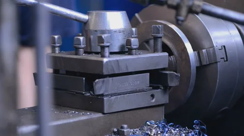 Mechanics working on the milling machine hand checks item on milling machine Stock Footage 57689472