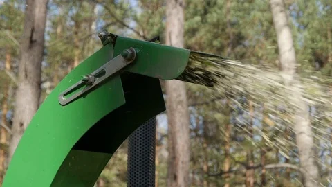The mechanism crushes the tree into chips Stock Footage 117412544