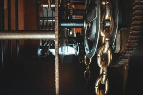 The mechanism inside the tower clock with a pendulum. Stock Photos