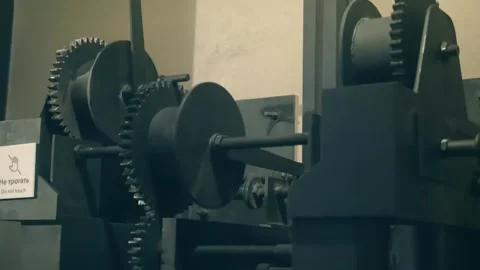 Mechanism for lifting loads to a height, consisting of many gears and a handle  Stock Footage 323856214