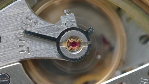 Mechanism of mechanical watch with focus on ruby stone on foreground Stock Footage 94718011