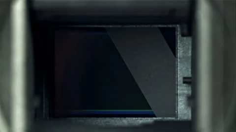 The mechanism of operation of broken camera shutters. Macro shot. Filmed on a Stock Footage 255012024